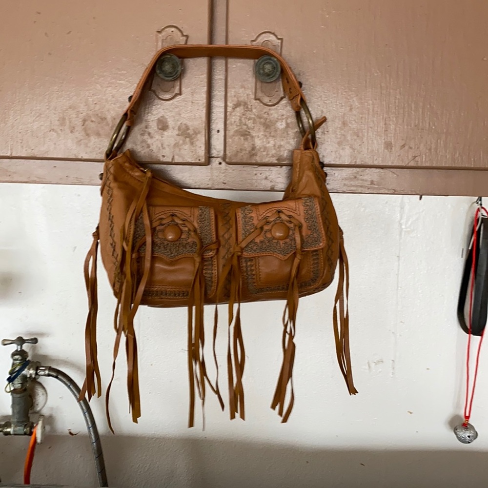 Betsy Johnson soft leather. Tassels like new used once no marks